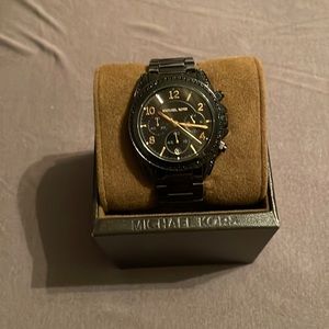 Black and gold Michael Kors watch
